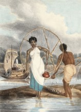 Fisherman and woman with net and small fish on shore, India, authentic, digitally restored