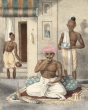 A high-ranking Hindu man eating a shrimp, India, authentic, digitally restored reproduction from a