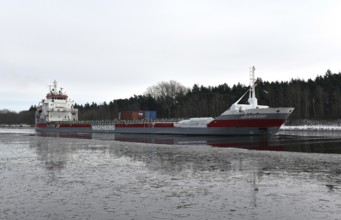 General cargo carrier LOIREBORG sails in the icy Kiel Canal, NOK, Kiel Canal, Kiel Canal,
