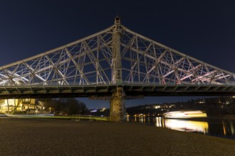 Elbbrücke Blaues Wunder at night, an illuminated Saxon steamship steamer sails on the Elbe, the