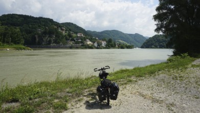 Cycling on the banks of the Danube with rolling hills and clouds, cycling on the long-distance