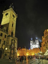 Night view, view of the historic Old Town Square with brightly lit buildings and towers and many