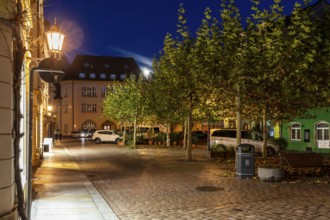 Atmospheric night view at a small market with a full moon, Meissen, Saxony, Germany