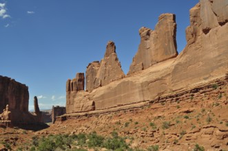 Majestic sandstone rocks, Wall Street, dominate the landscape under a clear sky, Arches National