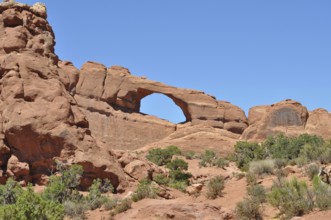 Skyline Arch, a large rock arch in a barren desert landscape, Arches National Park, Utah, USA