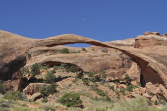 Landscape Arch, an imposing, far-reaching rock arch in a rocky desert environment, Arches National