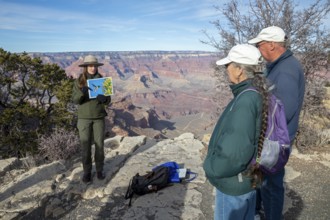 Grand Canyon National Park, Arizona. A park ranger gives a talk to park visitors about birds and