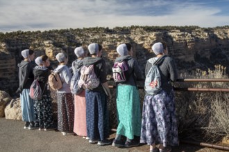 Grand Canyon National Park, Arizona. Young Mennonite women from Wisconsin, wearing traditional