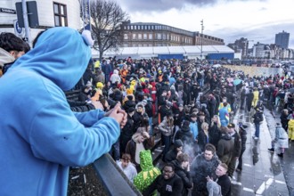 Banks of the Rhine on the old town, despite rainy weather, many, mostly young people gather here to