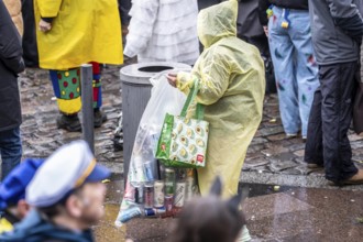 Pawn collector in the old town moving on Rose Monday in Düsseldorf, North Rhine-Westphalia, Germany