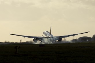 Boeing 777 A7-BFL commercial jet aircraft of Qatar cargo in flight landing on the runway at London