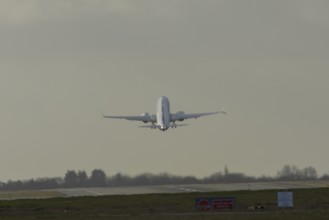 Boeing 737 commercial passenger airliner jet aircraft taking off in flight at London Stansted