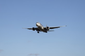 Boeing 777 commercial jet aircraft of Qatar cargo in flight on approach to London Stansted airport,