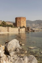 Alanya, Turkey. April 7th 2021 View of the Kizi Kule or Red Tower from the historic ancient castle