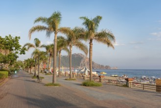 Seafront pedestrian walk and cycle path beside Cleopatra Beach in the Turkish holiday resort town