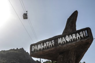 Alanya, Turkey. April 7th 2021 Entrance to Damlatas Magarasi with a cable car passing by. The cave
