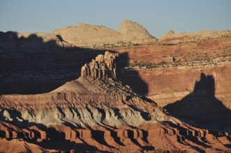 Rock formations in the desert with long shadows and red rock in the evening light, Capitol Reef