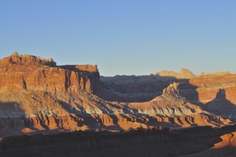 Rocks and shadows in a red desert landscape illuminated by the evening sun, Capitol Reef National
