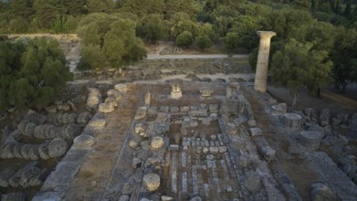Temple of Zeus in morning light, roof view over ancient ruins with stone pillars in wooded