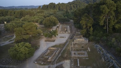 Soft morning light, Temple of Hera, ruins and thick forests in hilly surroundings, drone shot,