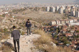 Ankara, Turkey. November 17th 2020 Young Turkish teens at Ankara castle with the urban sprawl of