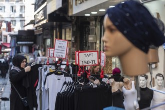 Istanbul, Turkey 7th January 2025. Local shoppers browsing clothes reduced in price in a popular