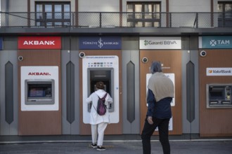 Istanbul, Turkey. September 18th 2025. Customers using Turkish ATM banking machines during a