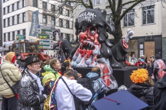 Rose Monday procession in Düsseldorf, theme car by wagon manufacturer Jacques Tilly, topic of mass