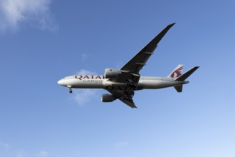 Boeing 777 A7-BFL commercial jet aircraft of Qatar cargo in flight on approach to land at London