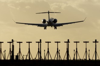 Gulfstream executive business jet aircraft in flight on approach to land at sunset at London