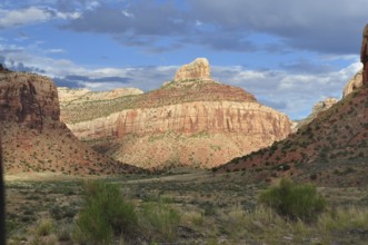 Beautiful rocky landscape under a blue sky with white clouds casting dramatic shadows, Canyonlands