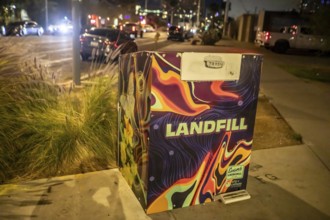 Phoenix, Arizona - A trash container in downtown Phoenix is marked 'landfill' to indicate that the