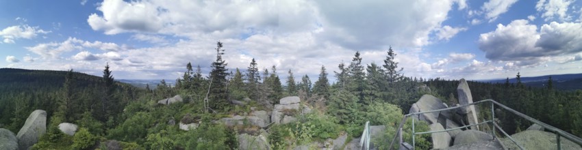 Panorama from Nusshardt over wooded area with views of rocks and sky, Franconian mountain trail,