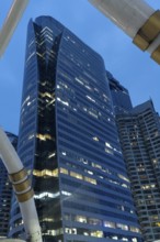 Bangkok, Thailand. March 26th 2025. Modern high rise office and condo buildings at night in Sathon