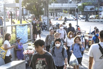 Bangkok, Thailand. March 25th 2025. Thai commuters enter and exit the Lumpini Metro station in the