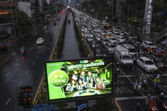 Bangkok, Thailand. March 26th 2025. An illuminated advertisement for Chang Beer in the busy