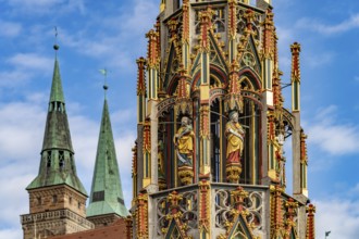 The Beautiful Fountain on the Main Market Square and the Towers of St. Sebaldus Church, Nuremberg,