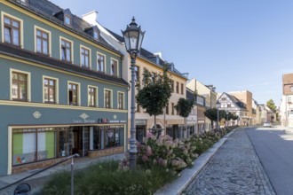 On the Altmarkt, in the background the historic postal goods, Hohenstein-Ernstthal, Saxony, Germany