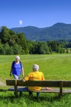 Elderly couple, seniors hiking, waiting at a rest area, Bad Heilbrunn, Upper Bavaria, Bavaria,