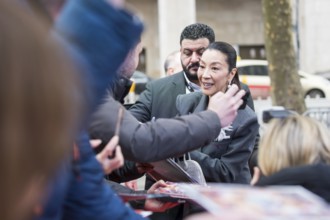 Michelle Yeoh signs autographs ahead of the premiere of the film Everything Everywhere All At Once