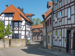 Street with half-timbered houses and cobblestones, Fachwerkstadt Osterwieck, Harz, Harzvorland,