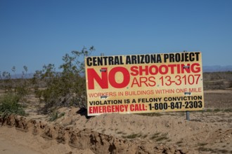 Buckeye, Arizona - A sign near the Central Arizona Project canal prohibits shooting because of