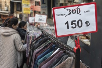Istanbul, Turkey 7th January 2025. Local shoppers browsing clothes reduced in price in a popular