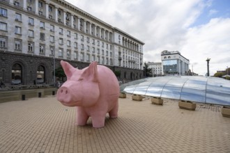 Sofia, Bulgaria. November 23rd 2025. A mock pink piggy bank instillation as a visual protest