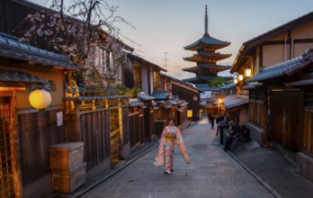 Japanese woman in kimono in an alley, Yasaka dori historic alleyway in the old town with