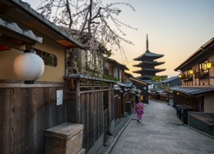 Japanese woman in kimono in an alley, Yasaka dori historic alleyway in the old town with