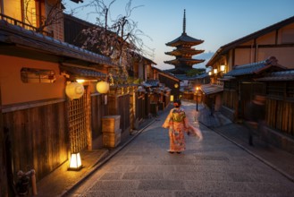 Japanese woman in kimono in an alley, Yasaka dori historic alleyway in the old town with