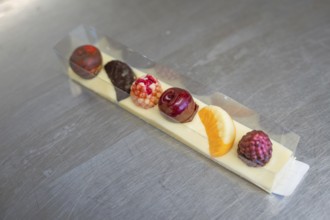 Elegant mix of chocolates in a decorative box with fruity accents, Easter production of regional