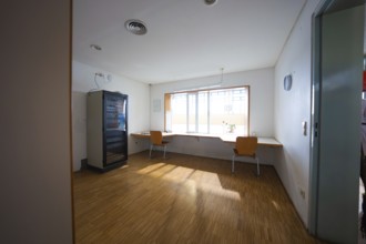 Simple break room with vending machine, chairs and large window, Schlehengäu sports hall Gechingen,