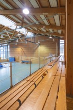 Interior of a gym with long benches and natural light, Schlehengäu Sporthalle Gechingen, Calw